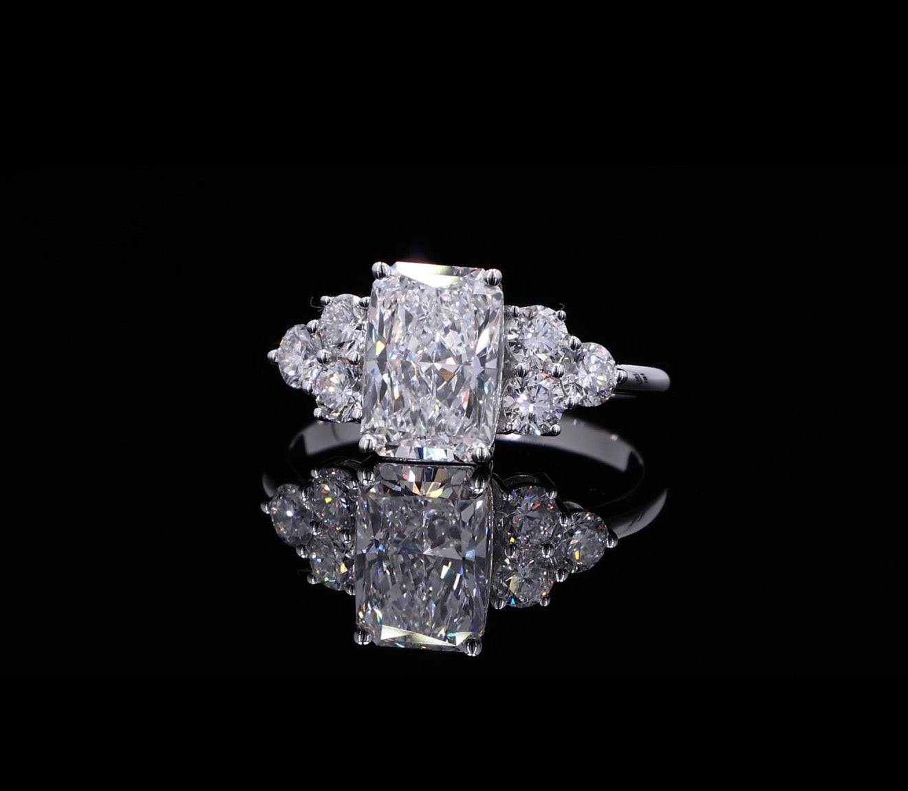 Radiant Cut Diamond Ring with Round Diamond Accents
